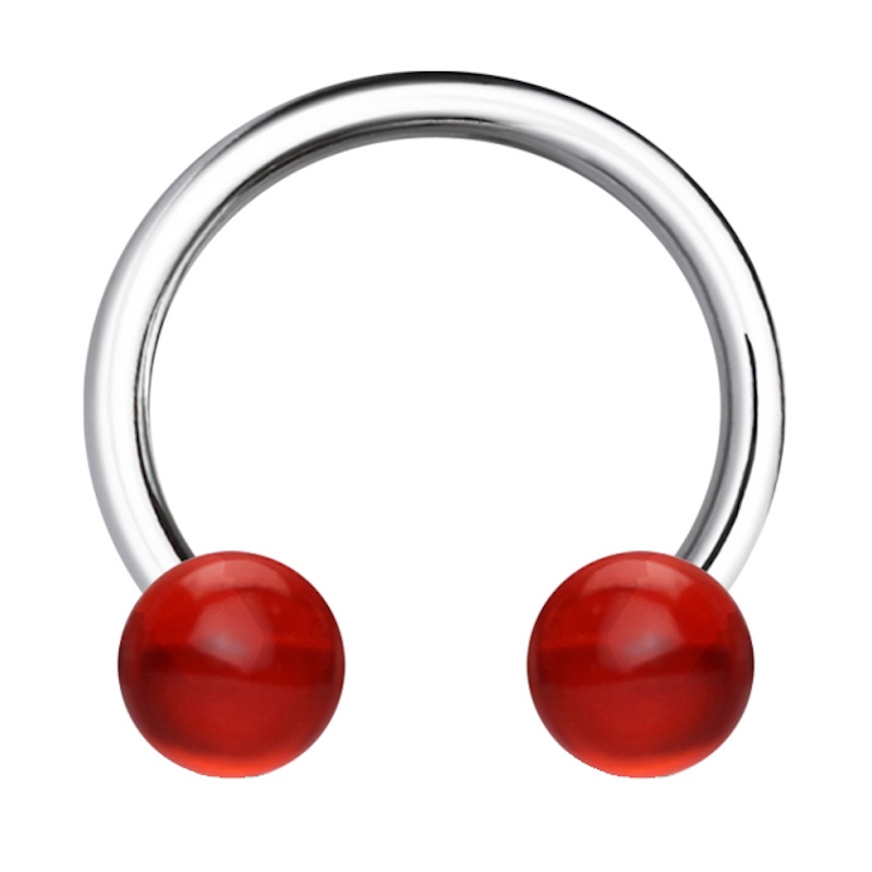 A surgical steel horseshoe septum ring with a red ball on each end pictured against a white background.