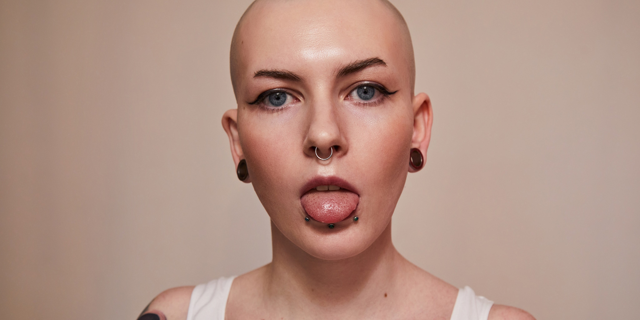 A person displaying multiple face piercings.