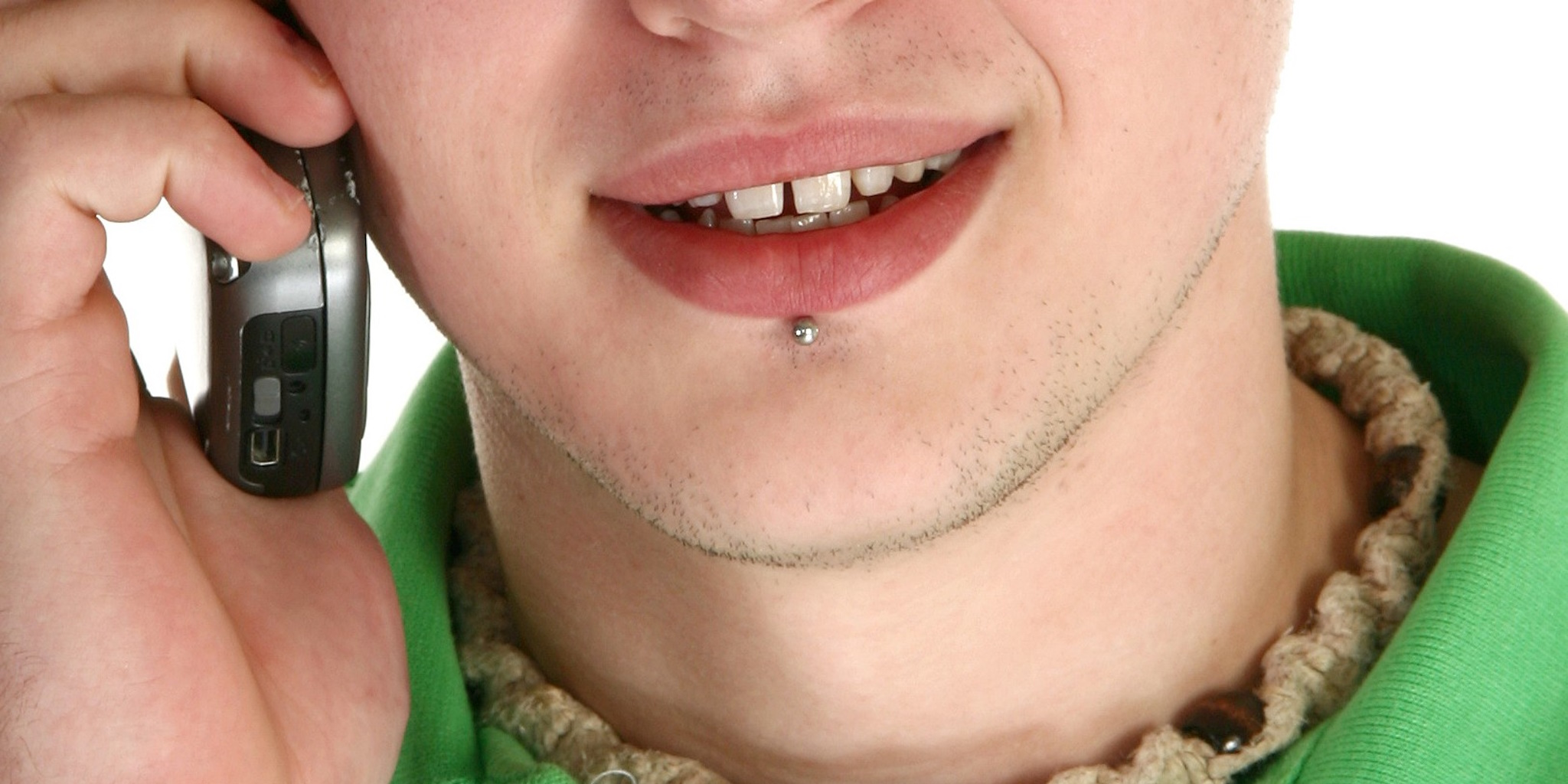 A man with a labret piercing under his lip.