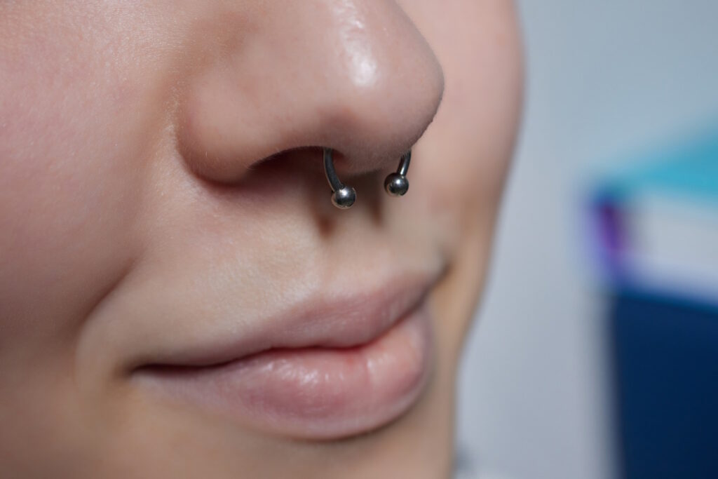 Woman with circular barbell in her piercing.