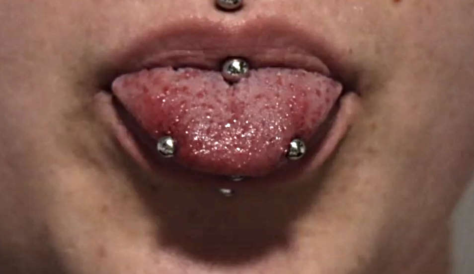 Two piercings on a tongue.