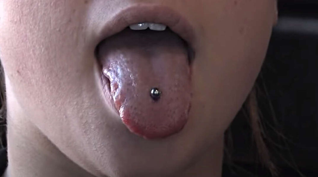 A person sticking their tongue out.