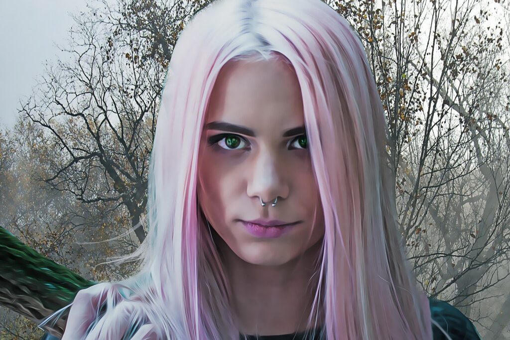 Girl with long pink hair and a septum piercing.